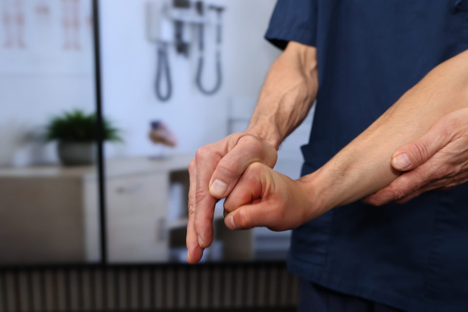The examiner stabilizes the forearm and tests isometric radial deviation of the wrist.