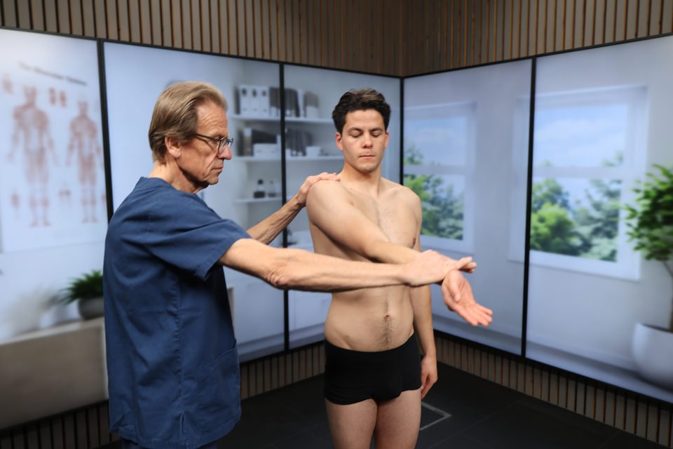 The examiner repeats O'Brien's test with the palm facing up.